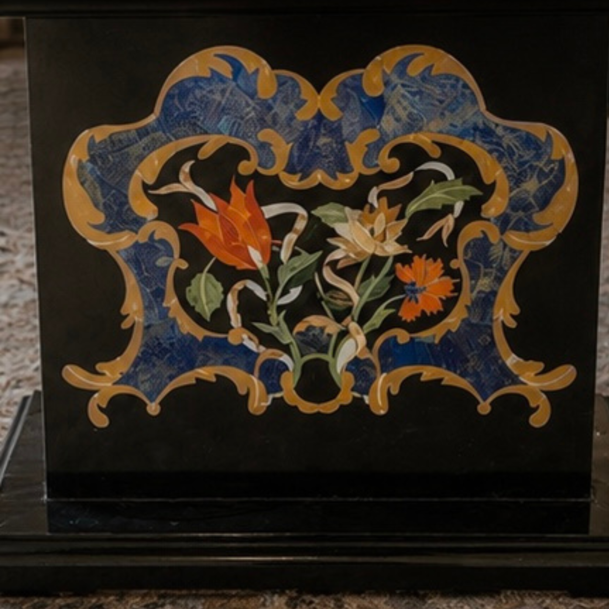 Semi-precious stone inlay table top features intricate pietra dura craftsmanship
