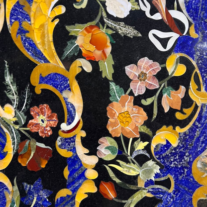 Semi-precious stone inlay table top features intricate pietra dura craftsmanship