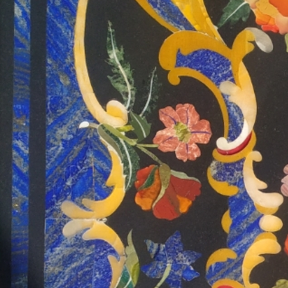 Semi-precious stone inlay table top features intricate pietra dura craftsmanship