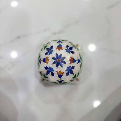 Marble carpet weight, inlaid with semi-precious stones | master of the carpet