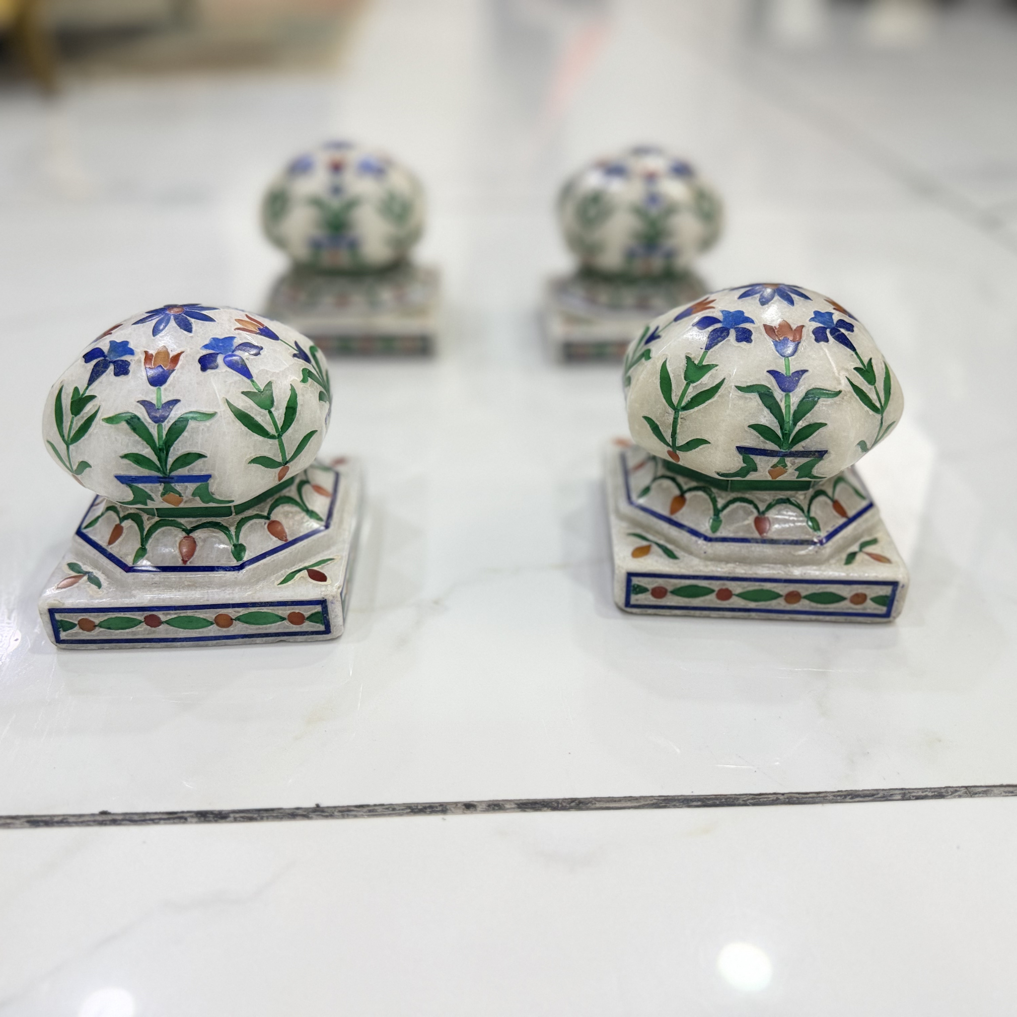 Marble carpet weight, inlaid with semi-precious stones | master of the carpet