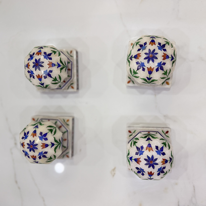 Marble carpet weight, inlaid with semi-precious stones | master of the carpet
