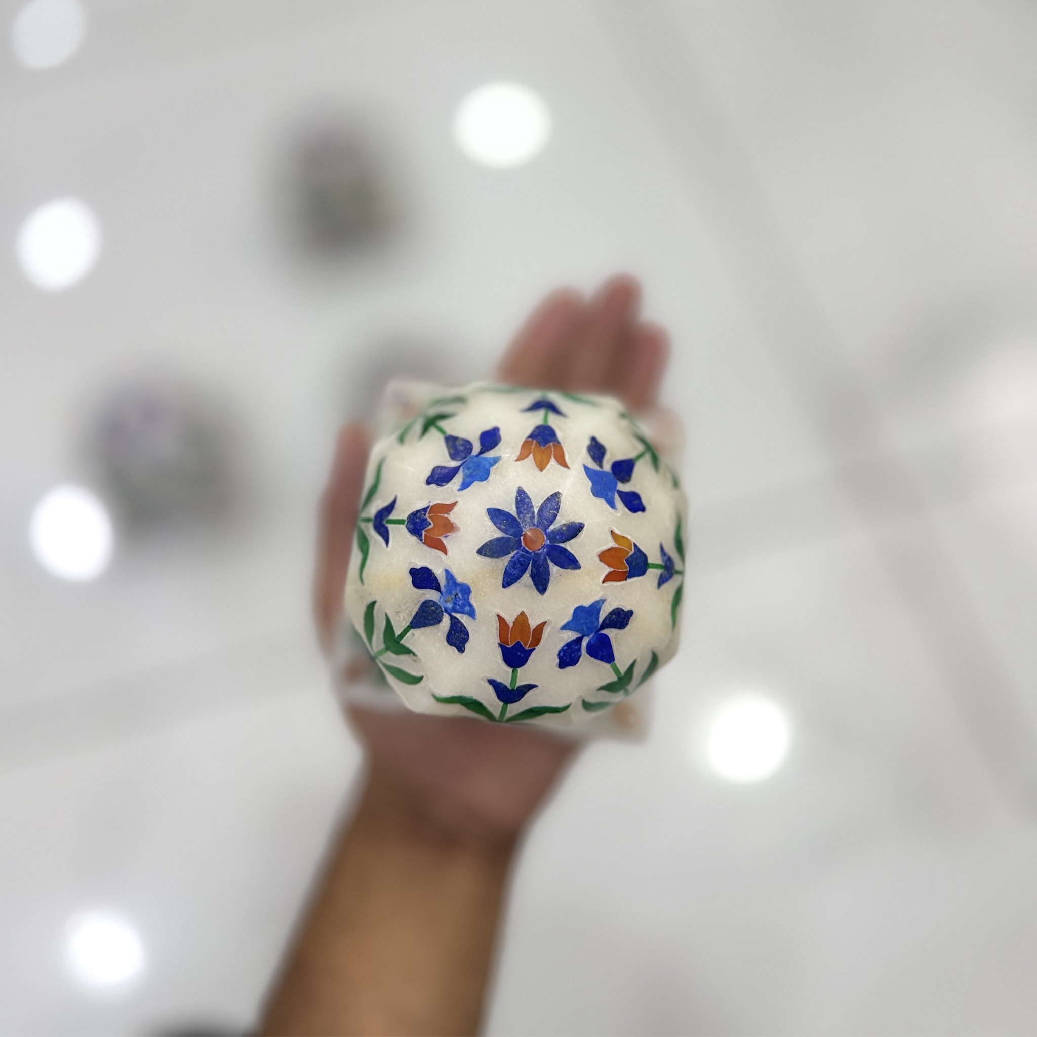Marble carpet weight, inlaid with semi-precious stones | master of the carpet