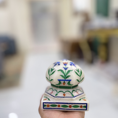Marble carpet weight, inlaid with semi-precious stones | master of the carpet