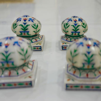 Marble carpet weight, inlaid with semi-precious stones | master of the carpet