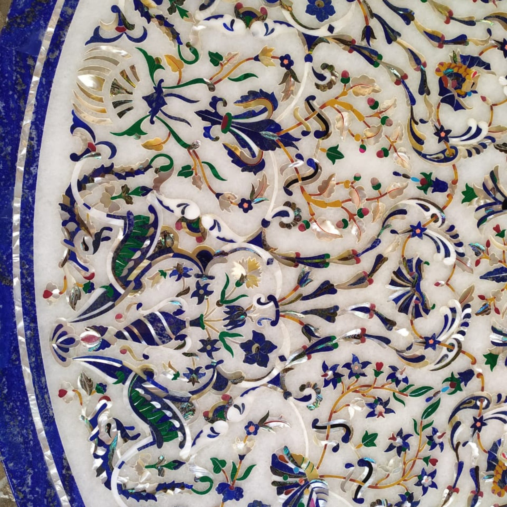 Handcrafted white marble dining table with marquetry inlay work and blue details